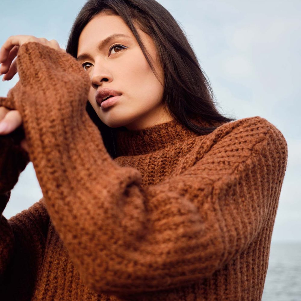 beautiful-asian-brunette-girl-in-cozy-knitted-JXDH6Q7.jpg
