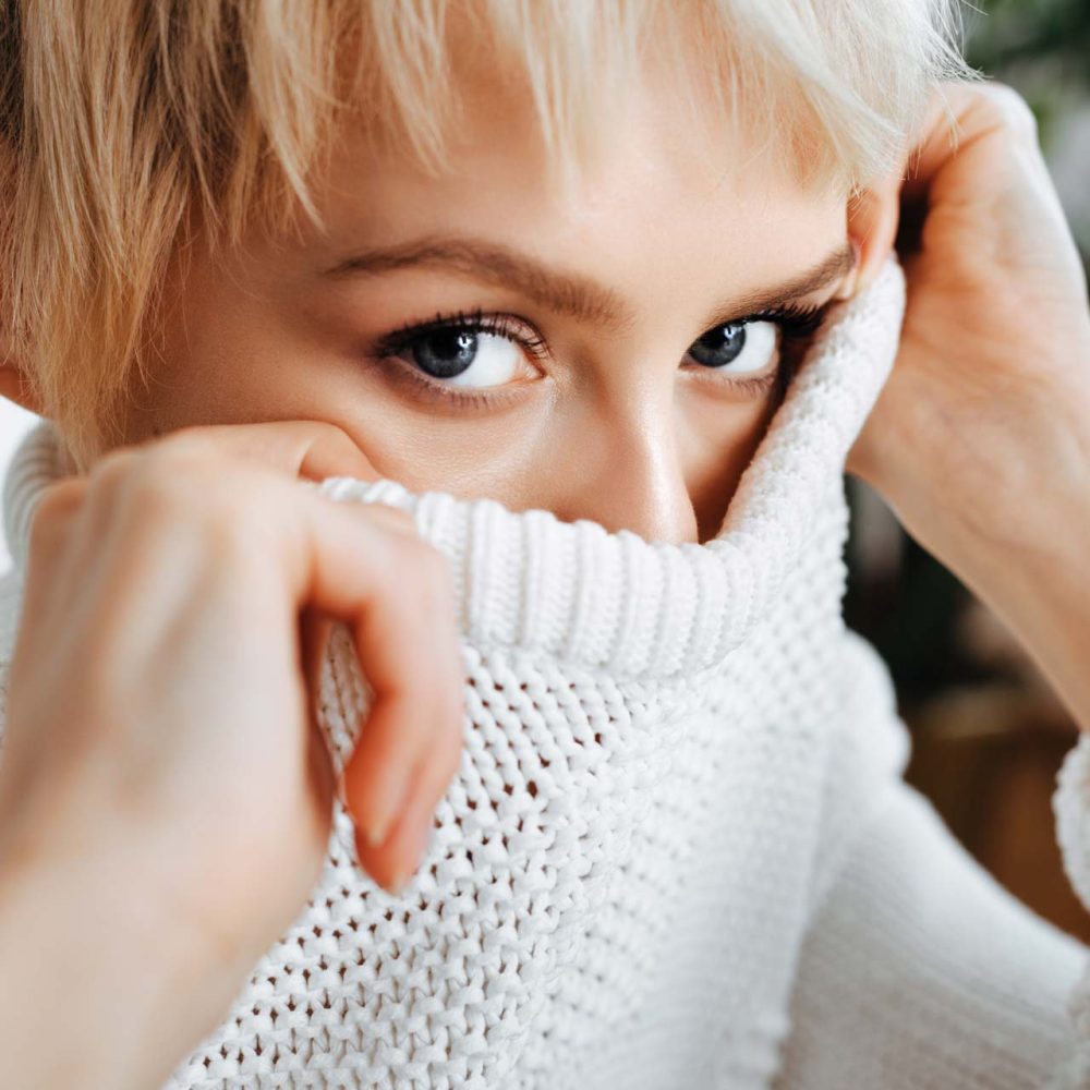 blonde-young-woman-wearing-sweater-P5APJ66.jpg